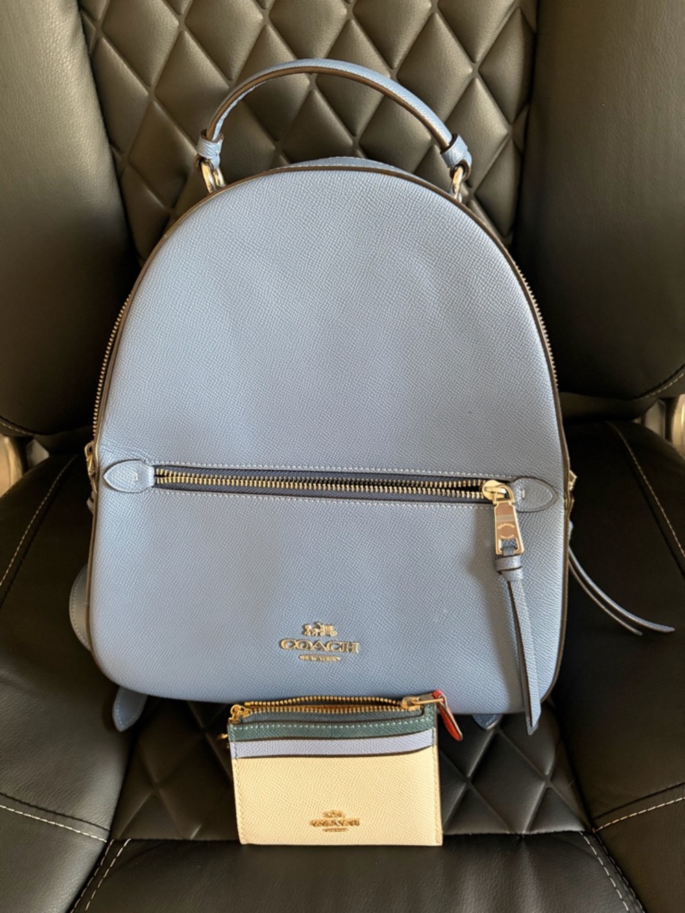 Coach Pale Blue Leather Backpack with Gold Hardware and matching card case.